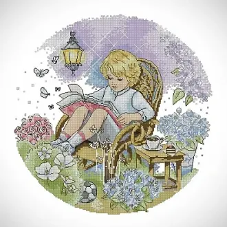 Вышивка Мальчик читает книгу в саду